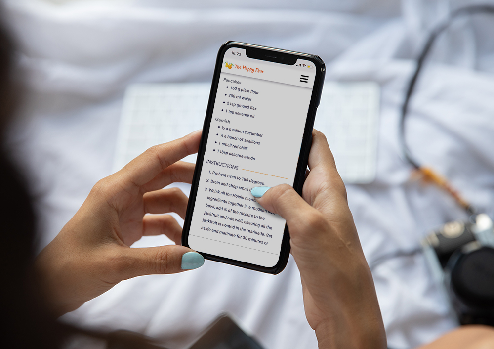 Image of a person using the happy pear app on their phone